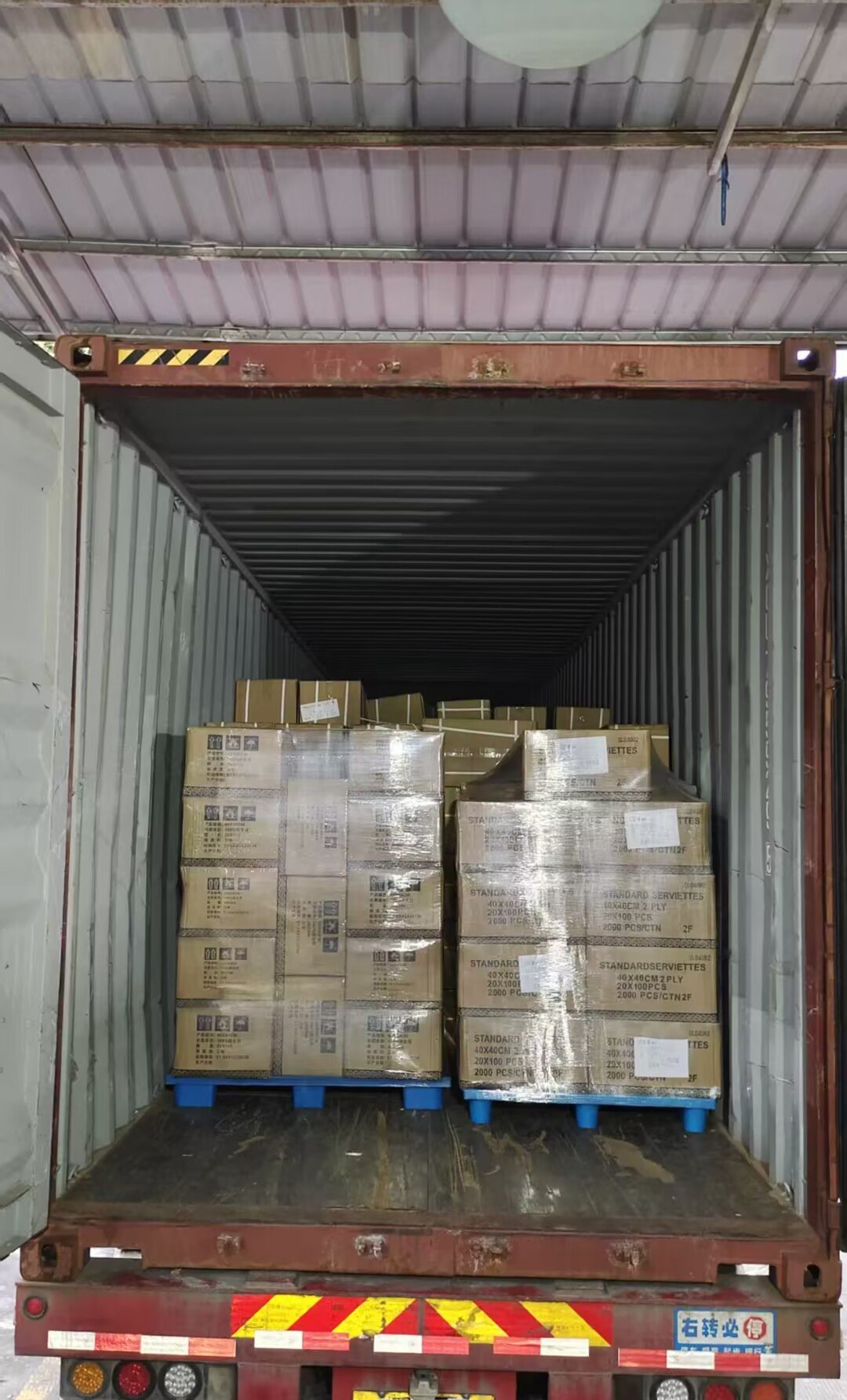 Palletized and shrink-wrapped cargo being loaded into a 40HQ container, Shenzhen to Sydney